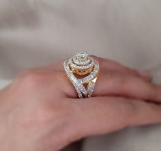 Elevate your elegance with our Golden Grace CZ Ring, meticulously crafted in silver and adorned with unique 5A lab-created diamonds by CZ for a luxurious appearance resembling real diamonds. Finished with 18kt gold plating and a highly-reflective rhodium polish, this ring not only exudes grace but also ensures long-lasting shine and durability, making it a perfect addition to your jewelry collection. Finish: Yellow Gold Plating Material: Silver, Alloy, CZ Stones Color: Gold, White Size: One Size Hand Set Yellow Gold Diamond Ring For Anniversary, Anniversary Yellow Gold Hand Set Diamond Ring, Anniversary Yellow Gold Diamond Ring With Hand Set, Dazzling Hand Set Diamond Ring For Anniversary, Dazzling Hand-set Diamond Ring For Anniversary, Diamond White Hand Set Diamond Ring For Anniversary, Hand Set Diamond Ring For Anniversary, Luxury Cubic Zirconia Cluster Ring With Diamond Cut, Hand Set Round Diamond Ring For Anniversary