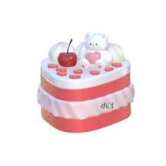 there is a small cake with teddy bears and an apple on top