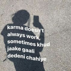 the shadow of a person holding a cell phone in their hand, with a quote written on it