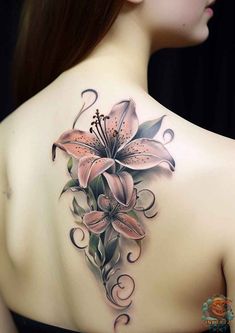 the back of a woman's shoulder with flowers and swirls on her chest