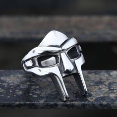 * Note: For back order items, please allow 20 working days of crafting time. Daniel Dumile, best known by his stage name MF... Mf Doom Ring, Doom Mask, Mf Doom Mask, Dr Doom, Doctor Doom, Metal Mask, Wedding Ring Bands Set, Mens Stainless Steel Rings, Mf Doom