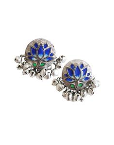 Blue Lotus Silver Studs : Handcrafted silver studs inspired from œPichwai" motifs with handpainted enamel.Size: 2.5cmx2.5cm Weight : 20 grams.Color:Blue and silver Care:If your design has enamel then each piece will be different from each other as they are hand painted. The metal used in making jewelry is silver plated brass. Please keep the jewelry in the given zip lock pouch. Avoid contact of jewelry with water. Avoid contact with harsh chemicals or cosmetics after wearing jewellery.Compositio Traditional Hand Painted Enamel Jewelry, Silver Jewelry With Peacock Design For Puja, Silver Peacock Design Jewelry For Puja, Silver Enamel Earrings For Wedding, Blue Jewelry For Diwali Puja, Blue Jewelry For Puja, Diwali Festival, Blue Jewelry For Puja And Diwali, Silver Earrings For Diwali Puja, Silver Earrings For Puja And Diwali