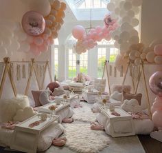 a room filled with lots of balloons and furniture