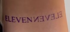 a woman's leg with the word elevennieve written in purple ink on it