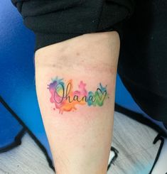 a woman's leg with the word ohana written in watercolor on it