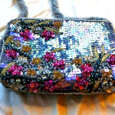 New, Never Used, Moyna Mini Bag, Sequence And Embroidery. 5 1/2 X 1 X 4. Adorable! Silver Embroidered Bag For Gift, Silver Embroidered Bags As Gift, Silver Sequined Clutch Bag, Silver Embroidered Bags Suitable For Gifts, Silver Embellished Bag For Everyday Use, Silver Rectangular Evening Bag With Sequins, Silver Embroidered Clutch Bag, Party Embroidered Silver Bag, Embroidered Silver Party Bag