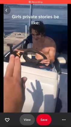 a man driving a boat on top of a lake next to a person holding a steering wheel