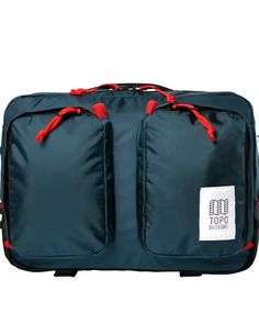 the topo carry - on rolling suitcase in blue with red handles