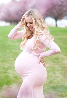 This Sexy Mama Maternity long-sleeve scoop-neck fitted maternity gown with a flare bottom is a modest maternity gown that exudes classic beauty. The dress is premium stretch material that provides equal parts comfort and style. Because it has a closed front it is perfect for your maternity photoshoot or any special occasion. (Pictured in Blush Pink.)  Maternity gown. Maternity dress. Maternity photography. Maternity session. Maternity photoshoot. Maternity poses. #SexyMamaMaternity Elegant Long Sleeve Bump Friendly Dress, Elegant Long Sleeve Maternity Dress, Bump Friendly, Elegant Long Sleeve Bump Friendly Maternity Dress, Modest Fitted Maternity Dress, Long Sleeve Bump Friendly Maternity Dress, Long Sleeve Maternity Dress, Bump Friendly, Fitted Bump Friendly Maternity Dress In Pink, Stretch Maternity Dresses With Long Sleeves, Long Sleeve Maternity Dress For Spring