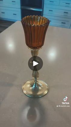 an empty wine glass sitting on top of a counter