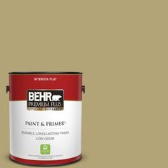 a can of behr premium plus paint and primer in one on a blue background