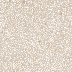 a white and beige background with small speckles