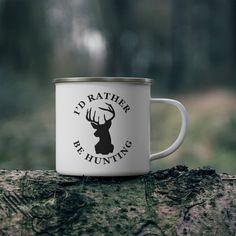 a white coffee mug with the words i'd rather be hunting printed on it