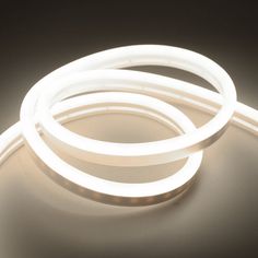 an image of a white light that is on the floor with some wires attached to it