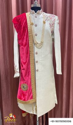 This sherwani includes Sherwani, Pajama/Pajami/Pant, Necklace, Dupatta. For any assistance, Whatsapp us at +91-9079290206 or mail us at heersuhaagchura4@gmail.com Diwali Sherwani With Dupatta And Kundan, Festive Bollywood Sherwani With Kundan, Raw Silk Sherwani With Traditional Drape For Ceremonies, Traditional Drape Raw Silk Sherwani For Ceremonies, Bollywood Style Kundan Sherwani With Dupatta, Pink Traditional Sherwani With Zari Work, Long Sherwani For Traditional Ceremonies And Festivals, Bandhgala With Zari Work For Traditional Ceremonies, Ceremonial Bollywood Sherwani With Kundan