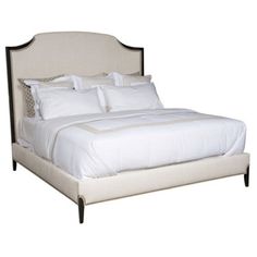 a bed with white sheets and pillows on it's headboard, in front of a white background