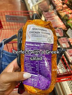 a person holding up a bag of chicken thighs in a grocery store with the caption perfect with a greek salad