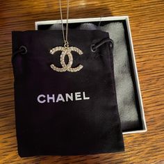 Chanel Logo Necklace. Never Worn. Received As A Gift Years Ago And Never Wore. Stored In Original Box & Dust Bag. Chain Is 18" Long I Believe. Front Has Stones All Along The C's. Very Pretty, Just Wasn't My Style. Luxury Diamond Necklace For Party, Designer Pendant Jewelry For Formal Occasions, Designer Round Necklace For Formal Occasions, Luxury Necklaces With Diamond Accents For Evening, Luxury Evening Necklaces With Diamond Accents, Luxury Jewelry Gift With Gift Box, Luxury Jewelry Gift With Gift Box Included, Luxury Diamond Accented Necklaces For Evening, Elegant Round Necklaces With Gift Box