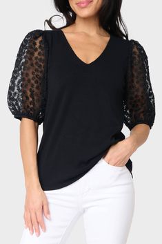 The Megan Mixed Media Soft Ponte Top is a perfect combination of classic and modern. This top features embroidered puff sleeves and a V-neck, creating a timeless yet chic look. It's made of a soft ponte fabric for all-day comfort and style. 93% Rayon | 7% Spandex Hand Wash Cold, Dry Flat. Length 25" Mei Li is 5'3 and wearing size XS Black V-neck Puff Sleeve Top For Fall, Stretch Puff Sleeve V-neck Top For Spring, Spring V-neck Stretch Puff Sleeve Top, Stretch V-neck Puff Sleeve Top For Spring, Chic Black Puff Sleeve Top With V-neck, V-neck Black Puff Sleeve Top For Fall, Black V-neck Puff Sleeve Top For Spring, Sheer Puff Sleeve Top, Sheer Sleeves Top