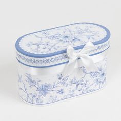 a blue and white box with a bow on the top is sitting in front of a white background