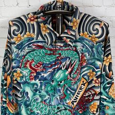 This Shirt Is So Fire!! Brand New With Tags Vintage New Old Stock From The 90's Rare Men's Avirex Full Body Tattoo Oriental Dragon Casual Button Up Shirt Size Xxl. Measurements Are 28 Inches Pit To Pit And 32 Inches In Length. Are You Ready To Own The Coolest Shirt Ever! Casual Long Sleeve Hawaiian Shirt With Graphic Print, Fitted Long Sleeve Camp Shirt Casual, Fitted Long Sleeve Casual Camp Shirt, Relaxed Fit Long Sleeve Camp Shirt With Graphic Print, Green Long Sleeve Hawaiian Cotton Shirt, Green Long Sleeve Cotton Hawaiian Shirt, Long Sleeve Cotton Hawaiian Shirt With Graphic Print, Long Sleeve Cotton Hawaiian Shirt With Button Closure, Cotton Hawaiian Shirt With Button Closure