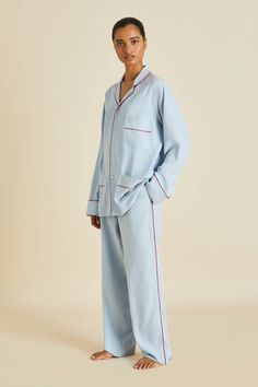 Our iconic Laurent silhouette receives a chic update in cerulean, with red-piped trims. Its generous proportions render all-day lounging an instantly stylish affair, for those who define their downtime in decadence. We designed this piece with a unique, genderless cut, so it can be worn by all. This style and silhouette is suited to all, and does not adhere to gender boundaries. Product Details Luxury pale blue washed silk pyjama set Genderless sizing Red 19 momme silk piped trims Mother of pear Luxury Pajamas Aesthetic, Designer Pyjamas, French Sleepwear, Pijama Outfit, Blue Pyjamas, Luxurious Loungewear, Lounge Wear Stylish, Satin Two Piece Set