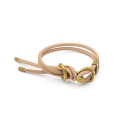 Hardware inspired by a vintage saddle bit, handmade with solid brass and our signature brass Giles &amp; Brother crimp.  Leather is calfskin from Italy, it is super s Chunky Bracelet, Chunky Bracelets, Round Leather, Leather Wrap Bracelet, Leather Wraps, Wrap Bracelet, Solid Brass, Saddle, Leather Bracelet