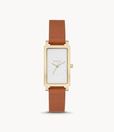 This Hagen features a 43x22mm rectangular case with a white sandblast dial  three-hand movement and luggage leather strap. The watch strap is interchangeable. Rectangular Watch, Brown Leather Watch, Three Hands, Leather Luggage, Skagen, Watch Strap, Leather Watch, Leather Straps, Brown Leather