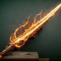 a piece of wood with fire coming out of it