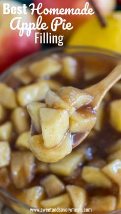 a spoon full of apple pie filling with apples in the background and text overlay that reads best homemade apple pie filling