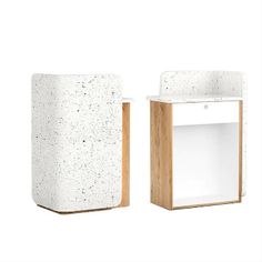 two white boxes with wood handles on each side and one in the middle, both made out of concrete