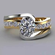 a diamond engagement ring set with two bands and a center stone in yellow gold plated silver