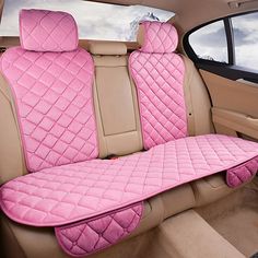 a car seat covered in pink quilted material