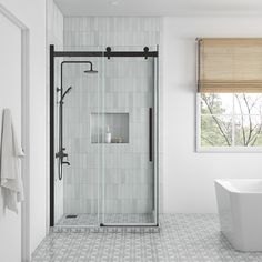 a bathroom with a tub, sink and shower stall in the middle of the room