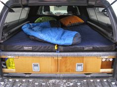 there is a sleeping bag in the back of this truck