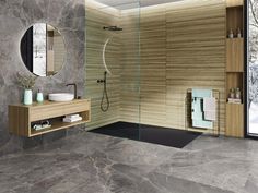 a modern bathroom with marble walls and flooring