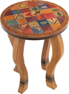 a wooden stool with colorful designs on it