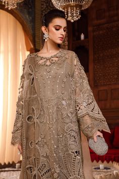 Chiffon Brown Salwar Kameez Pakistani Party Dresses come in a Tissue and chiffon combined shirt with intricate hand work and zardozi motifs paired with cotton salwar, which is simple and plain. Pakistani Party Dress Kameez: The traditional dress has a very stylish and elegant neckline emblazoned with moti and threadwork. This party attire is embellished with floral designs on Silk Tissue and adorned with pearls, dabka, naqshi, and gleaming stones. Salwar: Pakistani Party Dresses come in a tradit Nikkah Dress, Winter Formal Dresses, Gaun Fashion, Kids Frocks Design, Pakistani Wedding Outfits, Desi Clothes, Maria B, Kids Frocks, Dress Chiffon