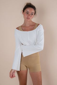 The new everyday eco-staple to style on top of your Yoga Sets or Yoga Crops. As our bodies need that effortless coverage piece to wear on & off the shala, this stunning new sporty boho design is ethically made from the latest sustainable material, EcoVero™ and features a scoop neckline, three front contouring panels, a semi cropped length and long flared sleeves for a playful flowy look. Style her tied around your waist so she is there when you need her. Asana Yoga Wear made to love and support your daily movement, so you feel held from the inside through your body’s natural flow. Eco-conscious new material with under bust contouring for feminine feels Super soft and stretchy ecovero rib that maintains its shape Gorgeous neckline and shoulder cuts that hold you perfectly Classic staple col Versatile Stretch Tops For Loungewear, Stretch Tops For Loungewear, Stretch Athleisure Top For Relaxation, Stretch Tops For Relaxation In Spring, Relaxed Fit Tops For Yoga In Fall, Relaxed Fit Yoga Tops For Fall, Fall Yoga Tops With Relaxed Fit, Versatile Yoga Tops For Spring, Versatile Spring Yoga Tops