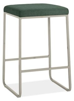 the backless stool is made from metal and green fabric