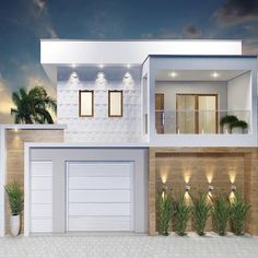 a white two story house with palm trees in the front yard and lights on at night