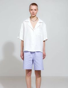 Open collar white linen short sleeve shirt. Made of soft drape washed linen fabric. Timeless wardrobe must-have. Fit:Open collarComfortable and oversize fit Drop shouldersHip lengthButton-up closureModel is 178 cm tall and is wearing size Medium Material & Production:100% linenMade in LatviaCare: Suggested wash: 30°C (max 40°C)no tumble drying Warm iron up to 180°C White Linen Shirt, Timeless Wardrobe, Linen Short, White Linen, Linen Shirt, Oversized Fits, Linen Fabric, Short Sleeve Shirt, Sleeve Shirt