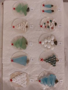 several different types of sea glass displayed on a sheet of paper with red and white stars