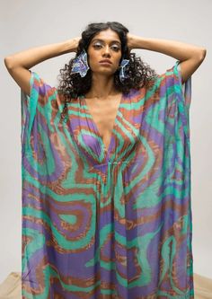 A V-neck kaftan style cover up with a front ruched detail. Please note, we do not provide a lining / slip. The model is wearing size XS. 🌸 〰️〰️〰️ 🌸 〰️〰️〰️ 🌸 Care and Composition100% Georgette.Dry clean/Hand wash in cold water. Mild liquid detergent only. Do not soak or wring. Designed & Made in India. Multicolor V-neck Beach Dress, Multicolor Flowy V-neck Kaftan, Casual V-neck Festival Cover-up, Chic V-neck Beach Party Cover-up, Chic Printed V-neck Kaftan, Multicolor V-neck Kaftan For Vacation, Multicolor V-neck Cover-up For Beach Party, Beachy Multicolor V-neck Cover-up, V-neck Kaftan For Vacation