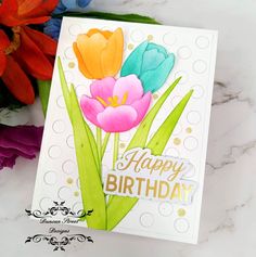 a happy birthday card with flowers on it