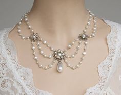 **** Photography by Alyssa Nikole Garza from Texas Amazing bridal wedding choker necklace features three silver plated filigree flowers set with Ivory white freshwater pearls surrounded with Swarovski AB rhinestone and connected between each flower with curled eye pins white freshwater Elegant White Bridal Necklace With Intricate Design, Elegant Bridal Necklace With Intricate Design In White, Exquisite Pearl Wedding Necklace, White Victorian Pearl Necklace, Silver Pearl Necklace With Intricate Design, Pearl Wedding Necklace With Jewels, Pearl Wedding Necklaces With Jewels, Exquisite Pearl White Wedding Necklace, Wedding Pearl Necklace With Intricate Design