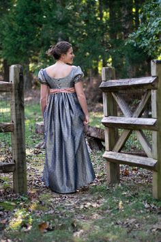 With historical events quickly approaching, a regency dress is uniquely suited for holidays, regency balls, celebrations, and feasts of all kinds. Made with a choice cotton, the dress features a long skirt, attached to a regency-style bodice. Don't miss out! This dress won't be here for long. *PLEASE NOTE* This dress is on clearance due to a flaw in the skirt back. The flaw is in the fabric but get lost in the folds of the dress. Please contact me for more photos. This dress is still beautiful and wearable, but can't be sold full price with a flaw in the material.  Occasions Wedding Bridesmaid Formal Dinner Recital Performance Theatre Drama Tea Reenactment Regency Ball Costume Holiday events Misses size 6 Bust 35" Just below bust to floor44" (custom hem is $45) Waistno waist What You Will Regency Style Blue Dress With Historical Design, Regency Style Historical Ball Gown, Regency Style Dress With Fitted Bodice, Empire Waist Dresses With Historical Design And Fitted Bodice, Regency Style Dress With Empire Waist And Historical Design, Regency Style Empire Waist Dress With Historical Design, Fitted Regency Dress With Historical Design, Regency Style Gown With Historical Design, Fitted Historical Regency Gown