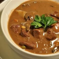 a bowl of soup with meat and vegetables