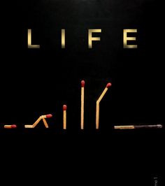 the words life spelled out with matches in front of them on a black background,