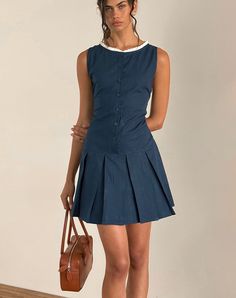 In a navy poplin, the Gitas dress features a mini, A-line design with a pleated skirt and a button up body. Boasting a boat neckline with a white broderie trim. MODEL WEARS SIZE: SMALL - MODEL HEIGHT: 5'9 Dainty Dress, Gameday Dress, Party Dress Long Sleeve, Bandeau Dress, Body Con Skirt, Boat Neckline, A Button, Maxi Dress Party, Party Dress Long